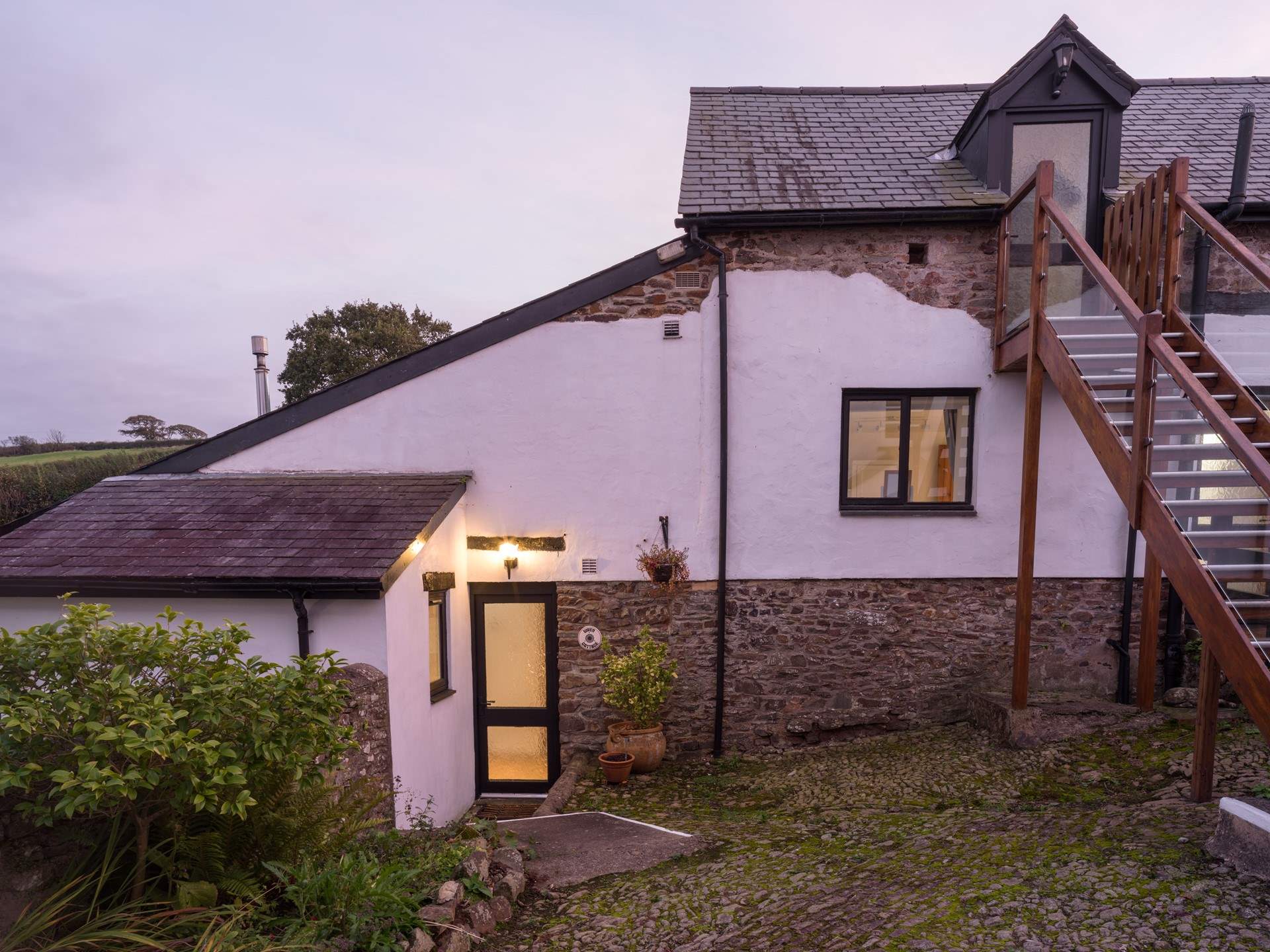 Head down the steps to Wren Cottage.