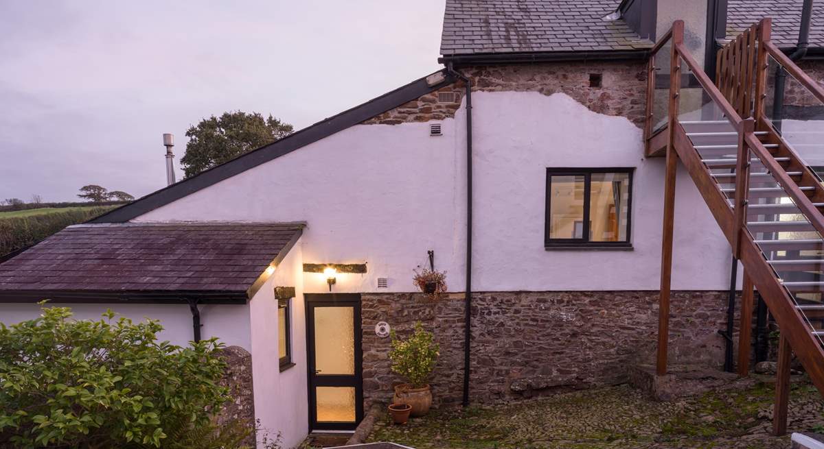 Head down the steps to Wren Cottage.