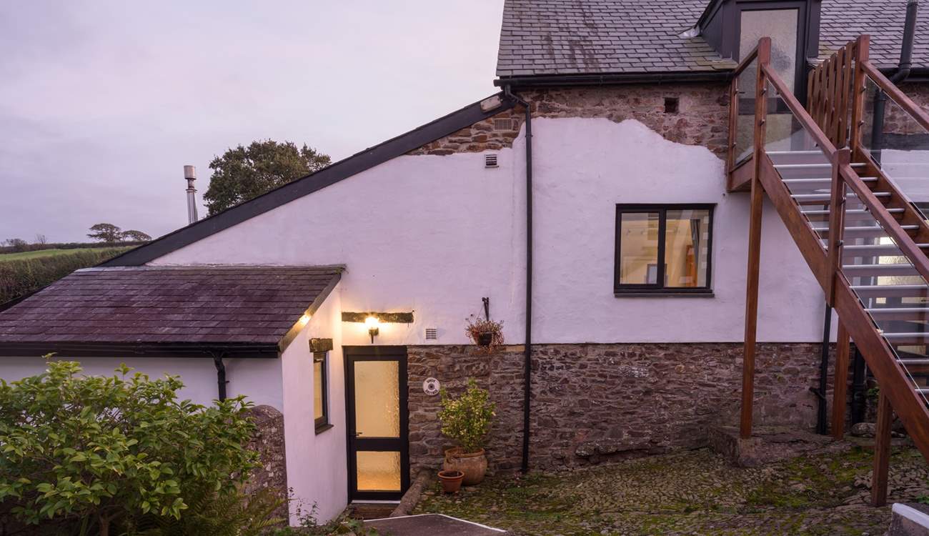 Head down the steps to Wren Cottage.