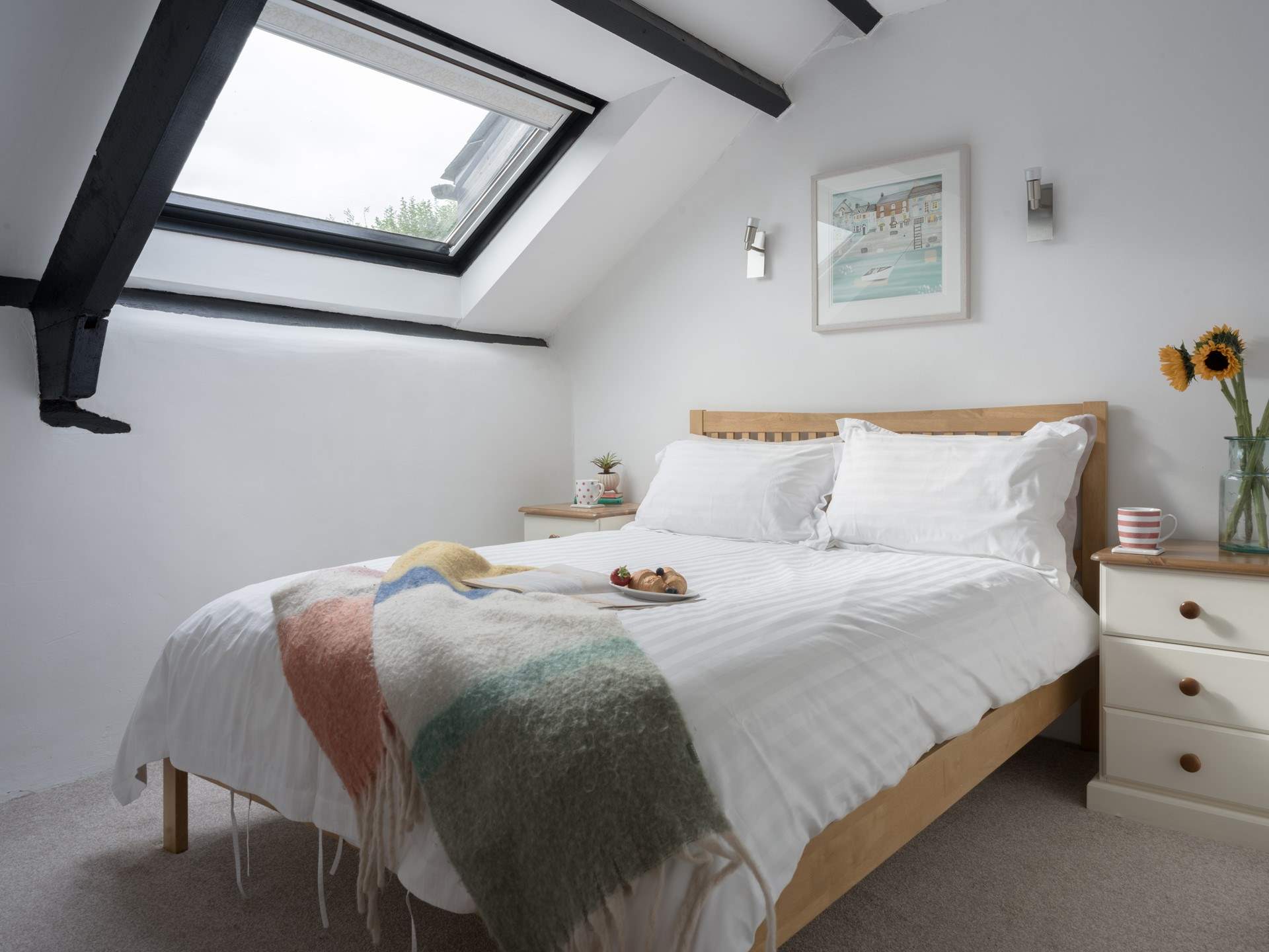 Sink into bed and enjoy a spot of star gazing through the Velux window.
