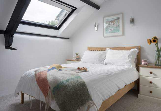 Sink into bed and enjoy a spot of star gazing through the Velux window.