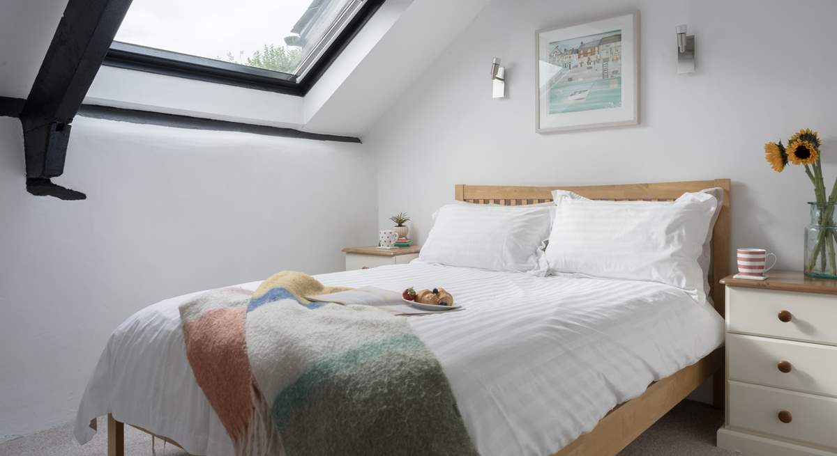 Sink into bed and enjoy a spot of star gazing through the Velux window.