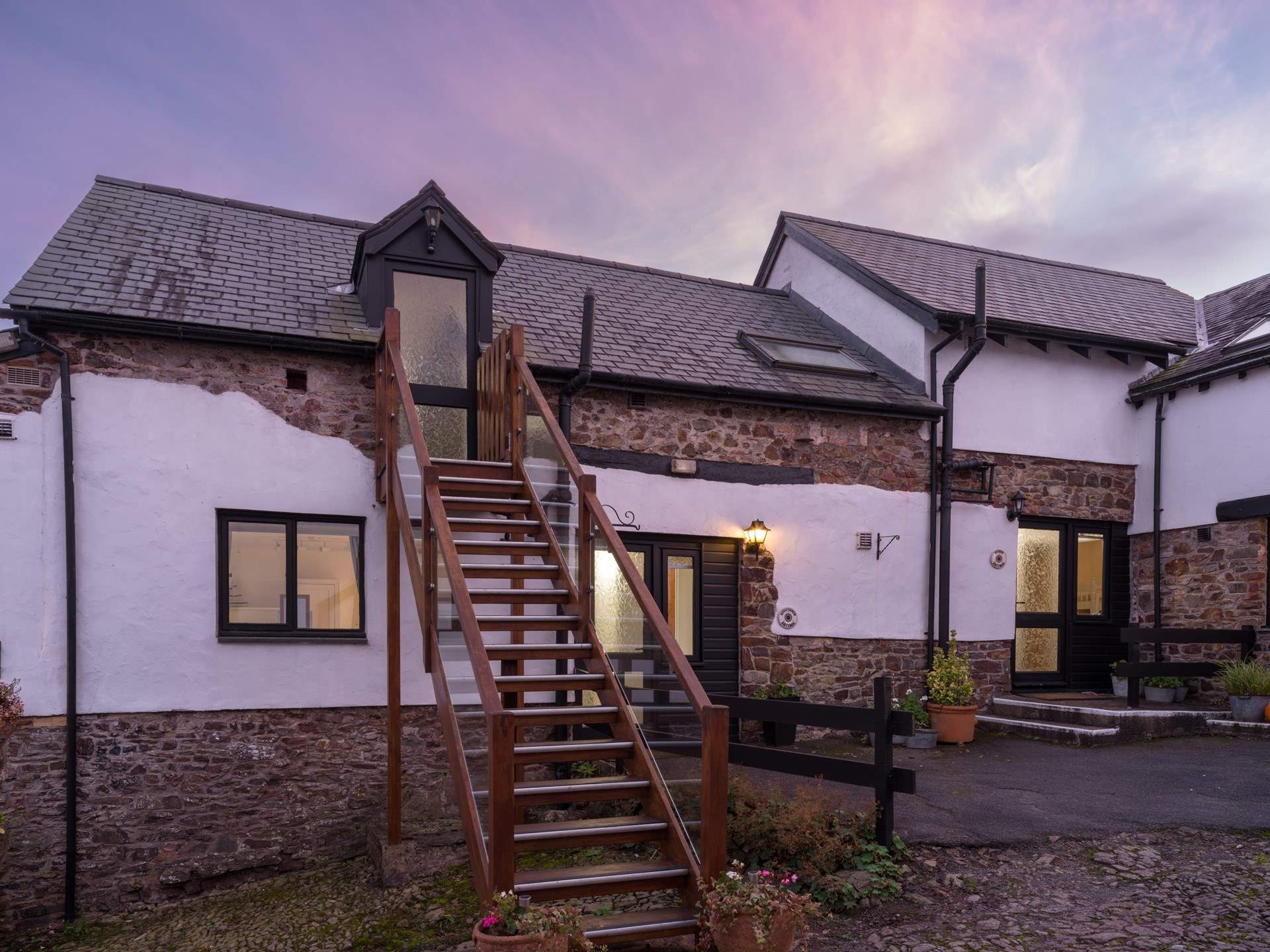 Climb the stairs to Swallow Cottage and enjoy the peaceful setting.