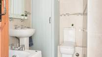 The family bathroom also has a fitted shower for that quick refresh in the morning before heading out for the day.