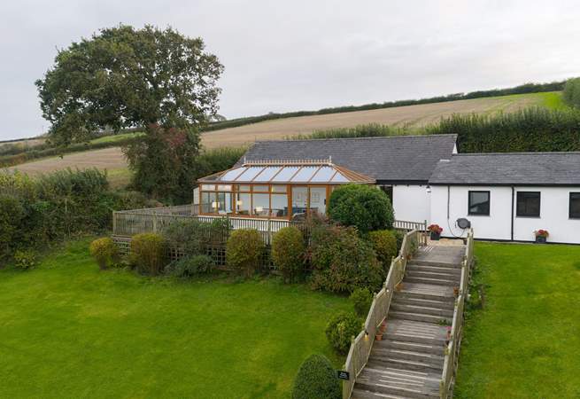 Take the steps up to the swimming pool and games-room.