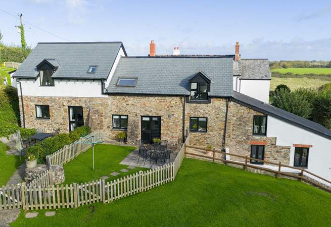 Kingfisher Cottage set in the middle of the run of cottages.
The garden gate takes you out to the communal grounds and across to the swimming pool and games-room.