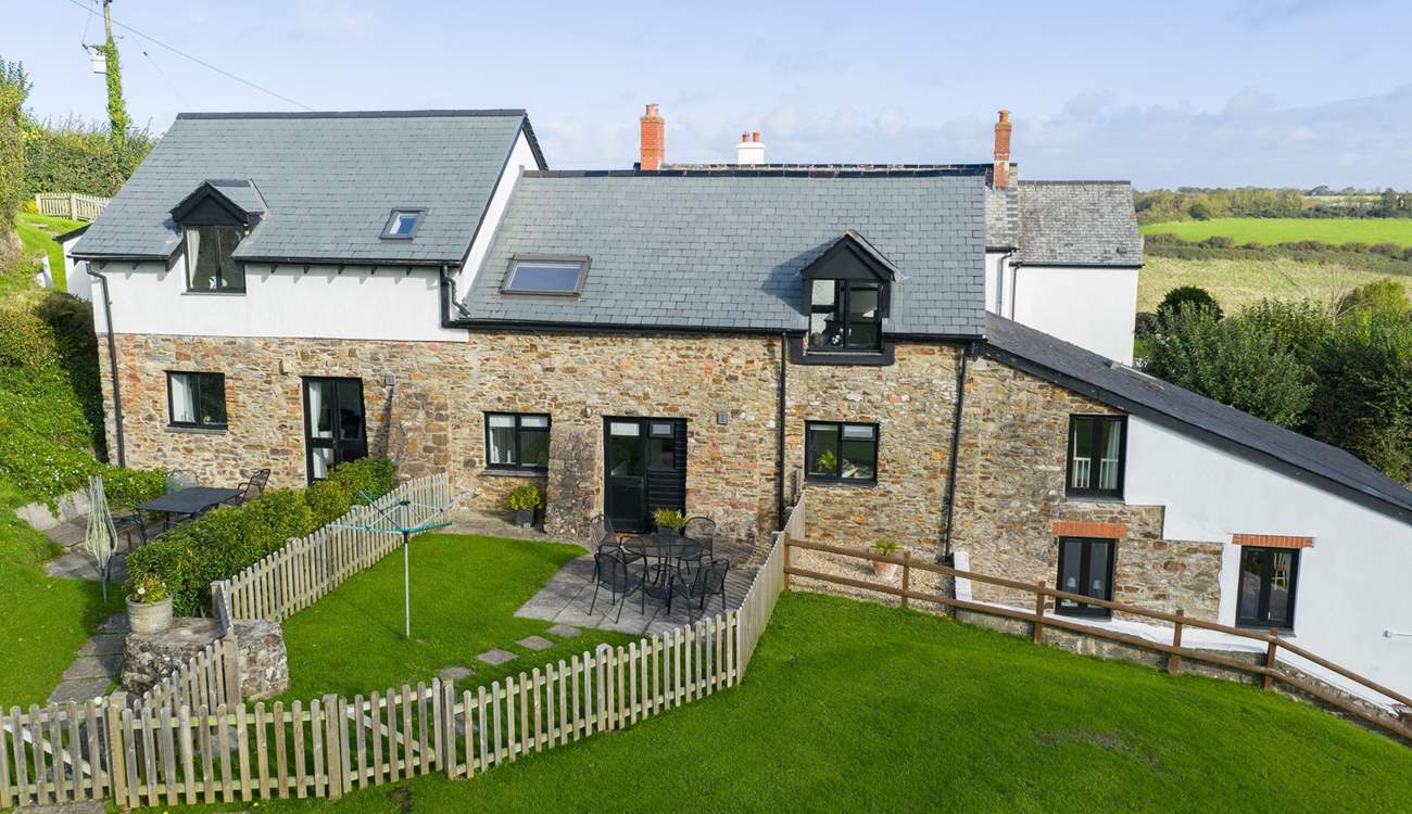 Kingfisher Cottage set in the middle of the run of cottages.
The garden gate takes you out to the communal grounds and across to the swimming pool and games-room.