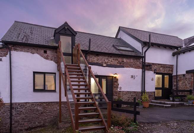 The pretty cobbled courtyard. Kingfisher Cottage is to the right of the stairs.
