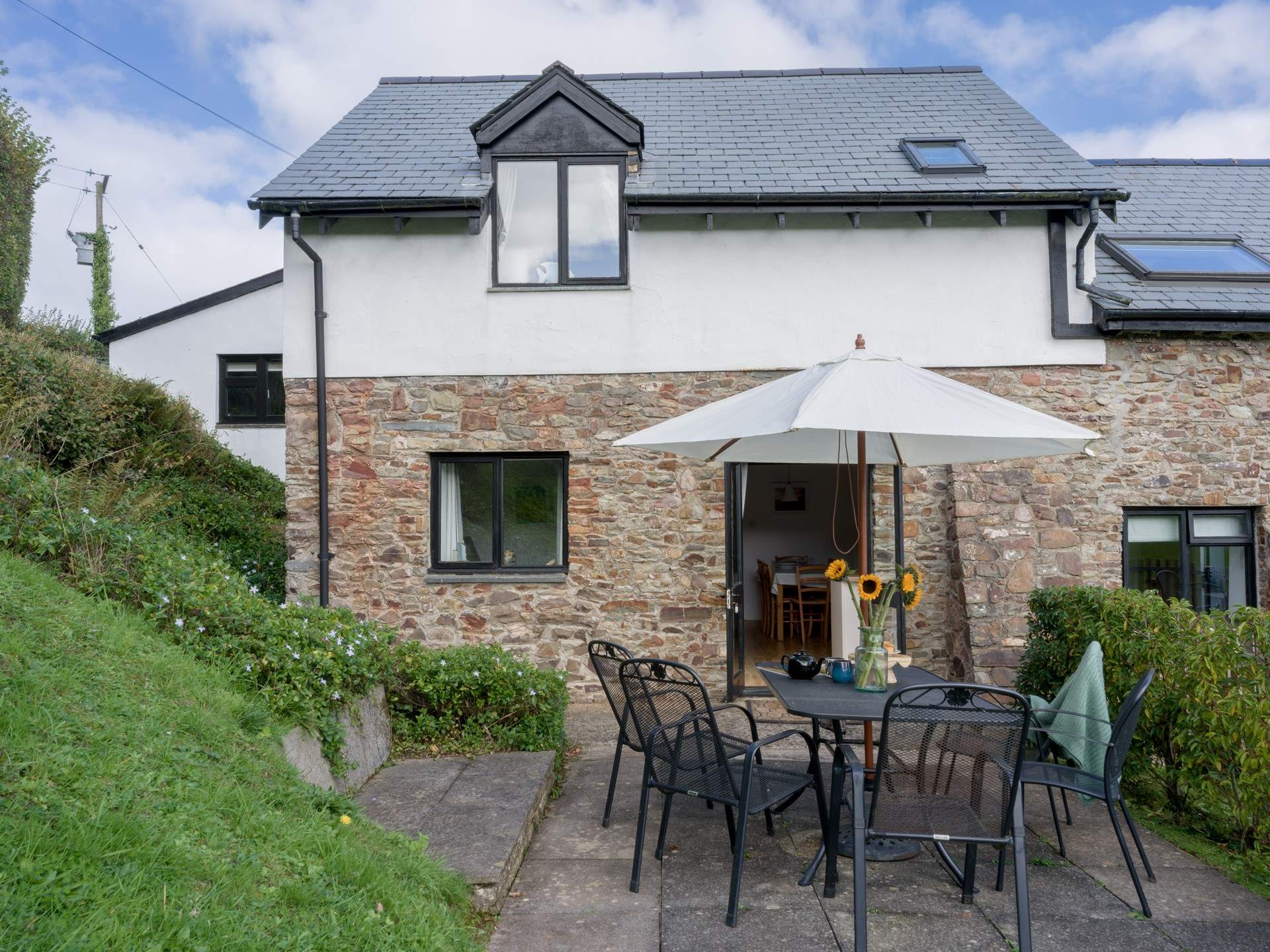 Enjoy a spot of al fresco dining following your warm welcome at Heron Cottage.