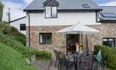 Enjoy a spot of al fresco dining following your warm welcome at Heron Cottage. - Thumbnail Image