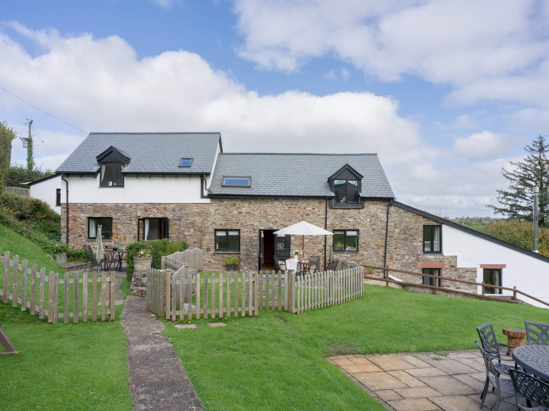 Head out of the gate and follow the path to the swimming pool and shared games-room.