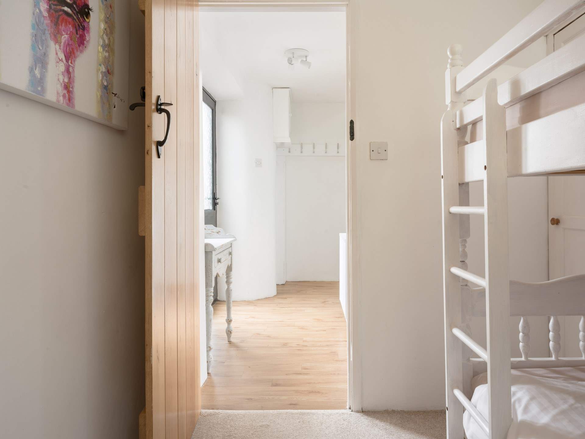 The bunk bedroom can be found on the ground floor.