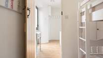 The bunk bedroom can be found on the ground floor.