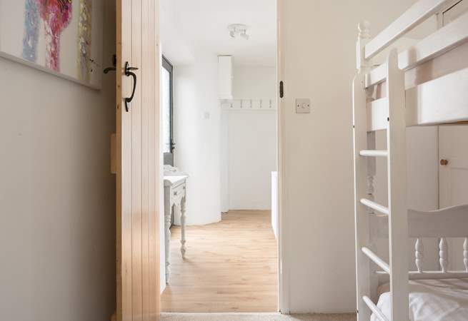 The bunk bedroom can be found on the ground floor.