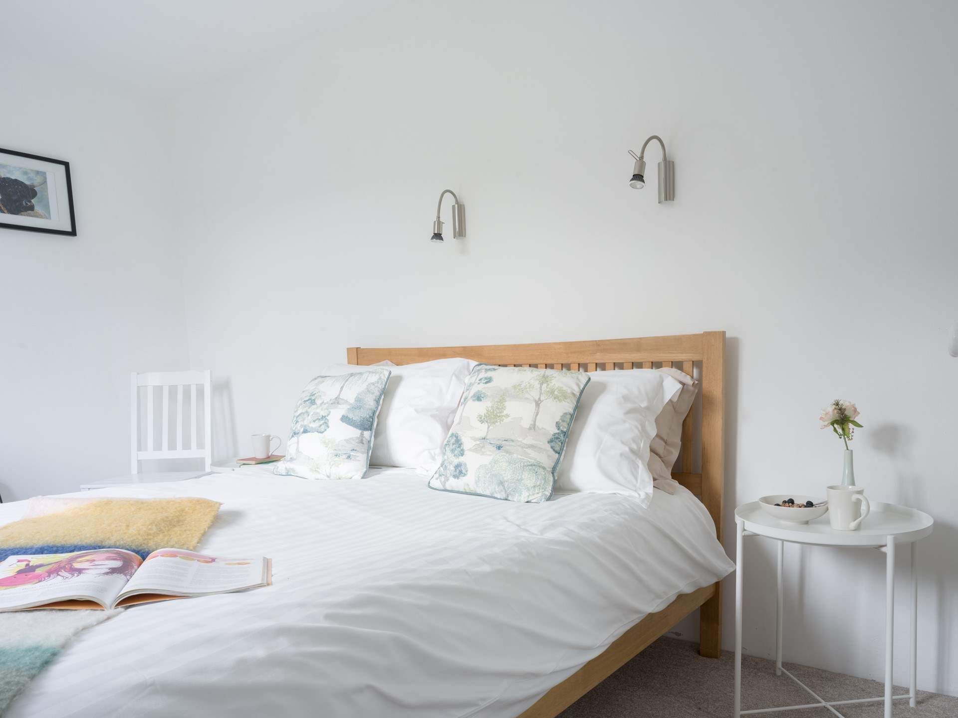 The main bedroom on the first floor has a light and airy feel.