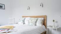 The main bedroom on the first floor has a light and airy feel.