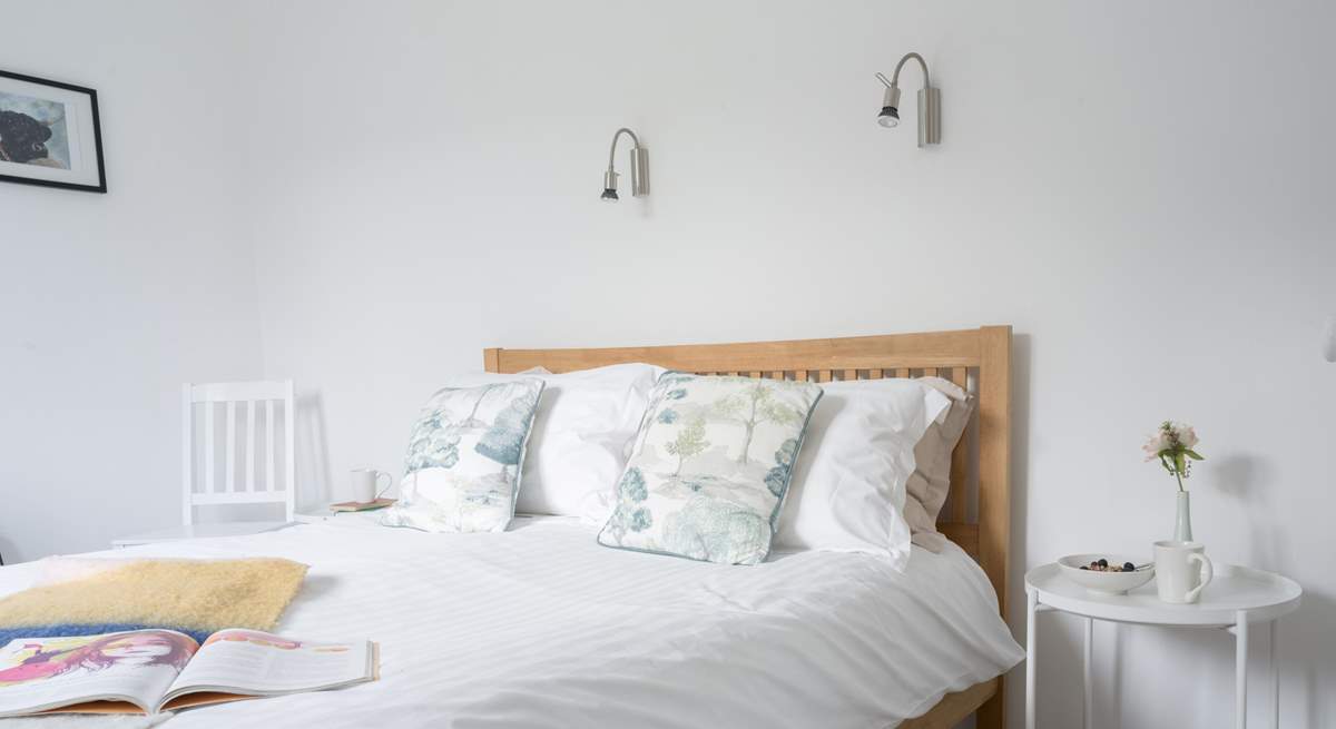 The main bedroom on the first floor has a light and airy feel.