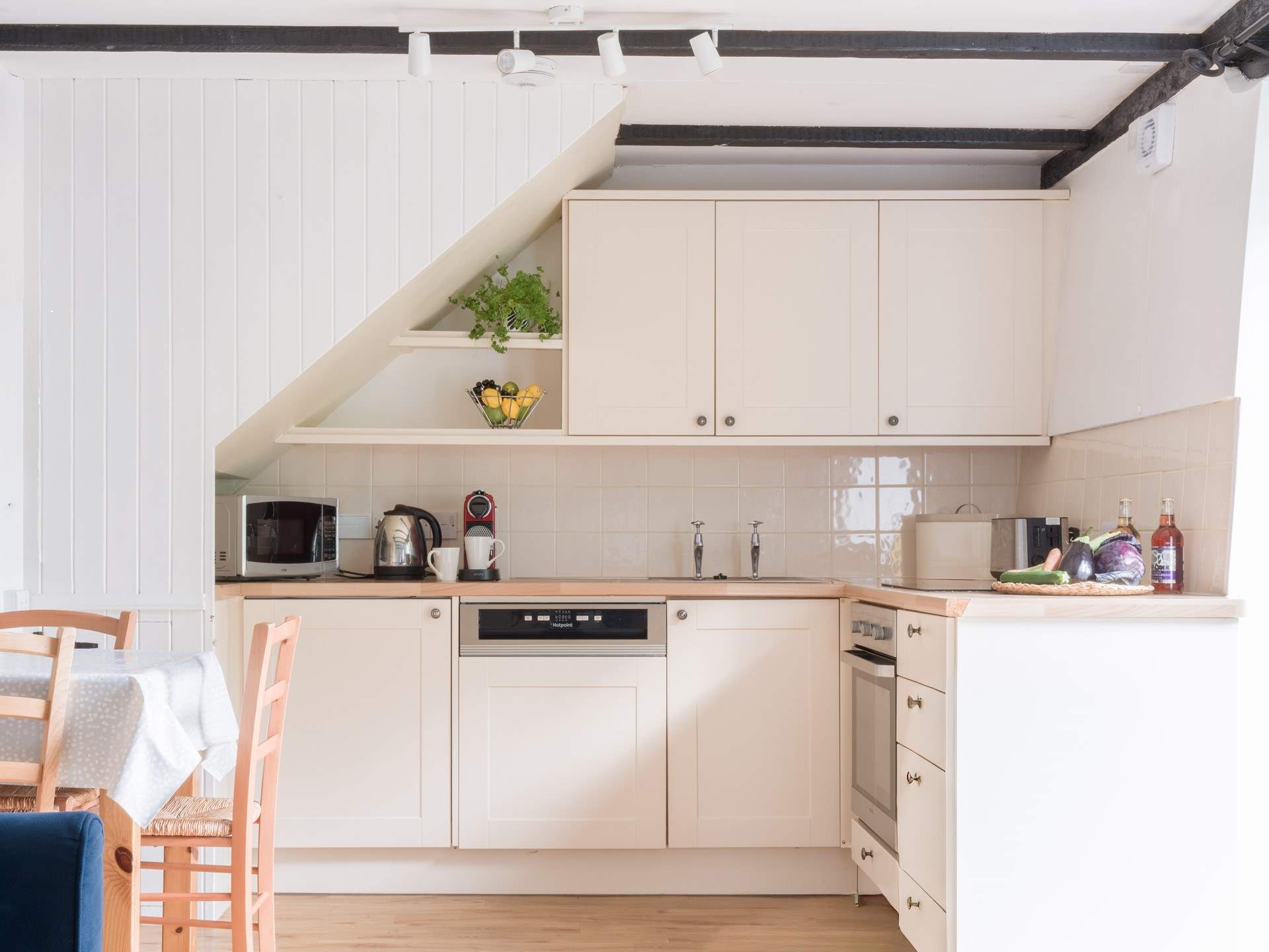 The neat kitchen has everything you will need for creating delicious meals.