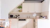 The neat kitchen has everything you will need for creating delicious meals.