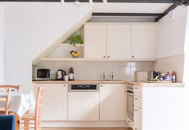 The neat kitchen has everything you will need for creating delicious meals.