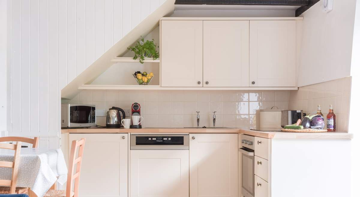 The neat kitchen has everything you will need for creating delicious meals.