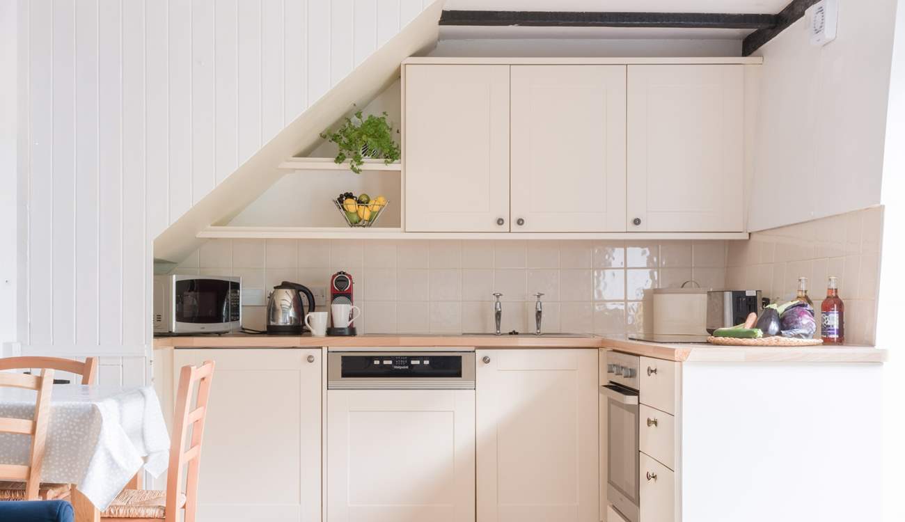 The neat kitchen has everything you will need for creating delicious meals.