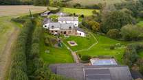 Welcome to Heron Cottage - your garden is the one with the white umbrella. Simply walk out of the back door, across the communal garden and enjoy a leisurely swim.