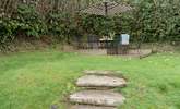 Steps lead up to the patio area at the top of the garden. - Thumbnail Image