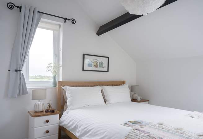 Bedroom 2 has a king-size bed and countryside views as far as the eye can see.