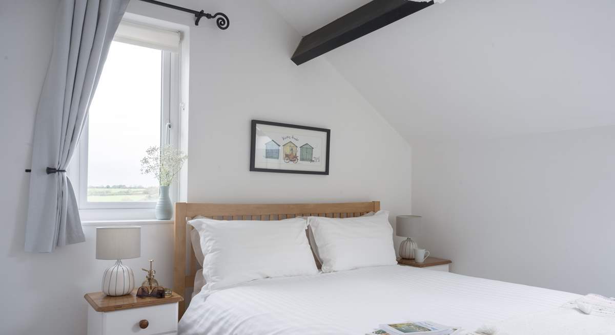 Bedroom 2 has a king-size bed and countryside views as far as the eye can see.