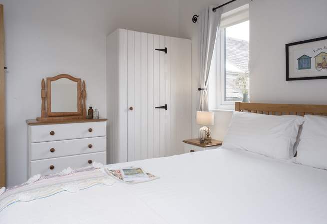 This calming bedroom offers the best spot to recharge at the end of each day.