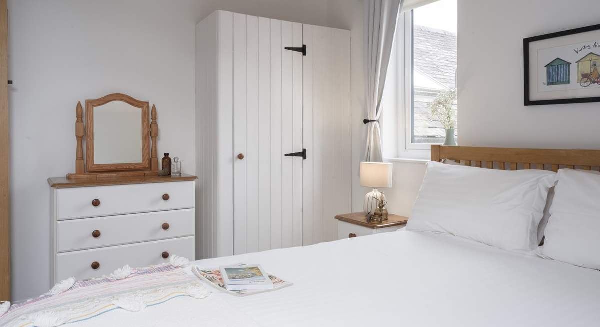 This calming bedroom offers the best spot to recharge at the end of each day.