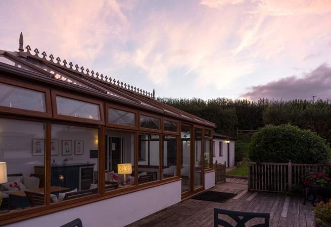The shared conservatory provides another place to relax and chill. The entrance to the pool is through the conservatory.