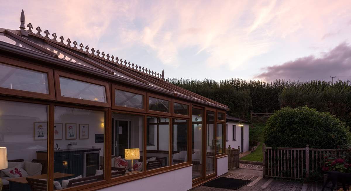 The shared conservatory provides another place to relax and chill. The entrance to the pool is through the conservatory.