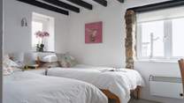 Pretty bedroom 2 is home to these twin beds.