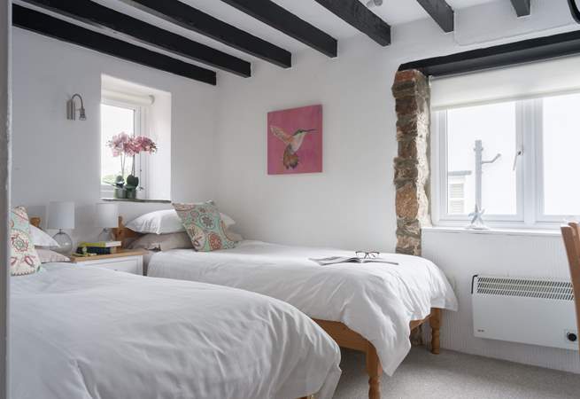 Pretty bedroom 2 is home to these twin beds.