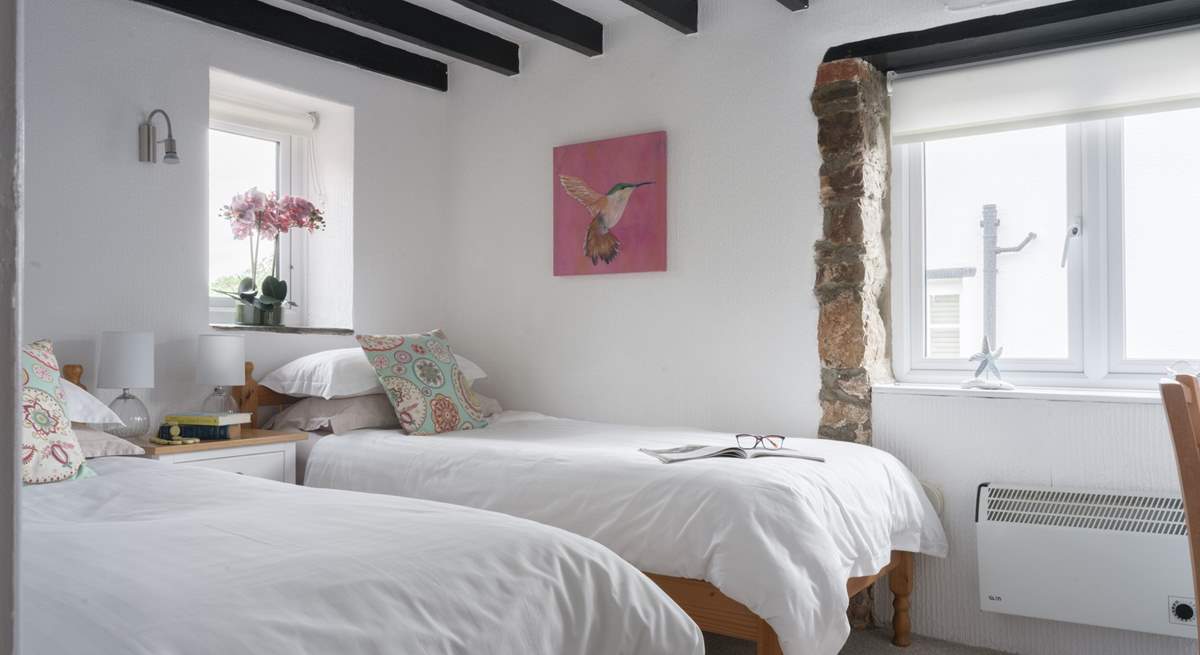 Pretty bedroom 2 is home to these twin beds.