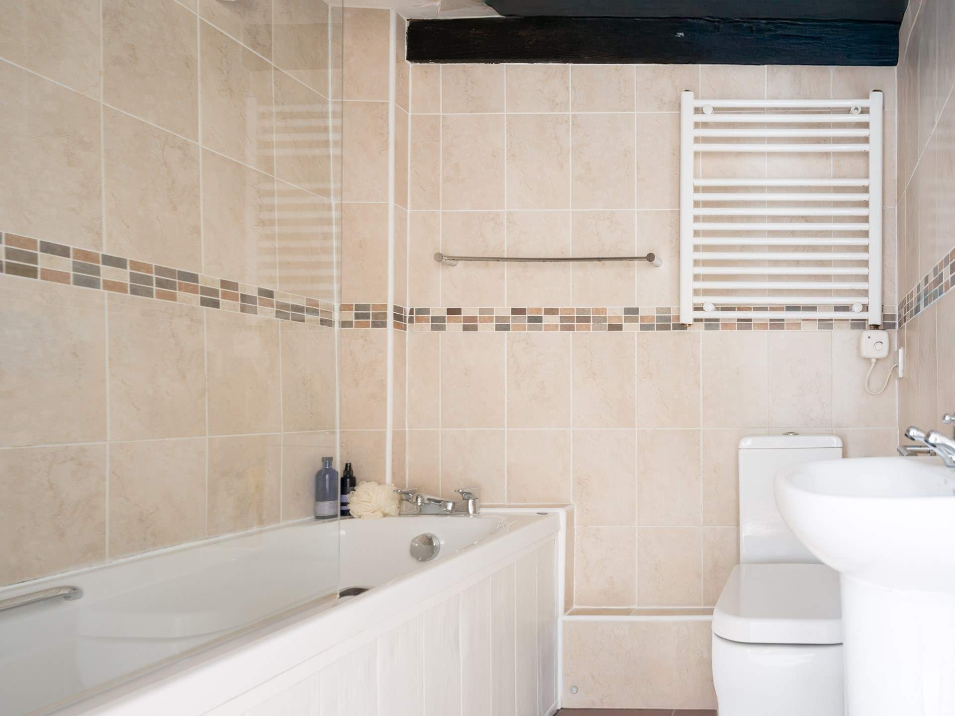 Enjoy a relaxing bath in the family bathroom. There's also a fitted shower for rinsing off those sandy toes.