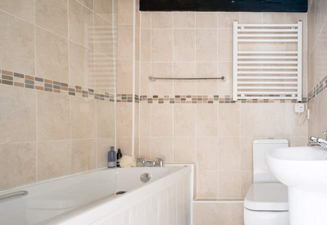 Enjoy a relaxing bath in the family bathroom. There's also a fitted shower for rinsing off those sandy toes.