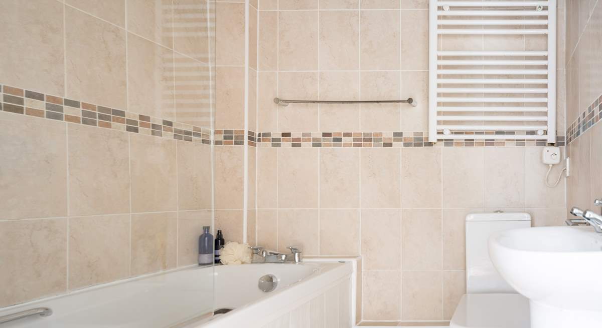 Enjoy a relaxing bath in the family bathroom. There's also a fitted shower for rinsing off those sandy toes.