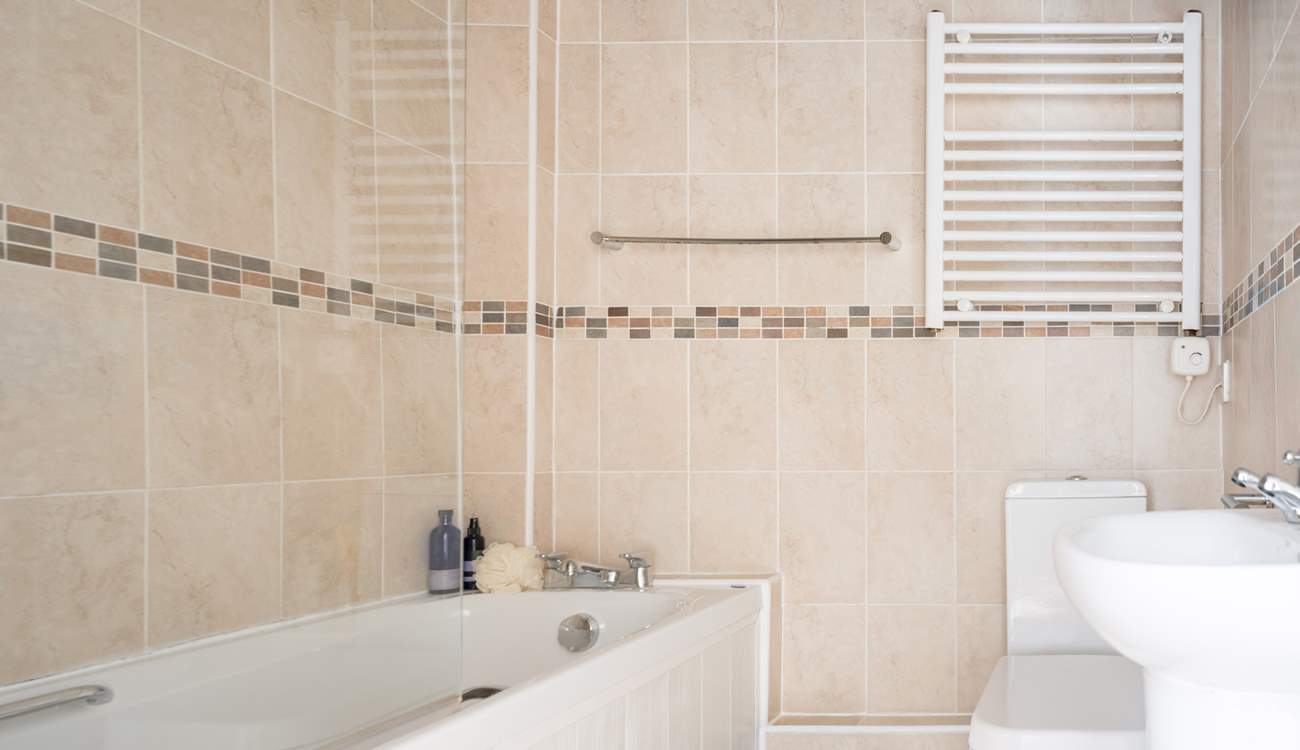 Enjoy a relaxing bath in the family bathroom. There's also a fitted shower for rinsing off those sandy toes.