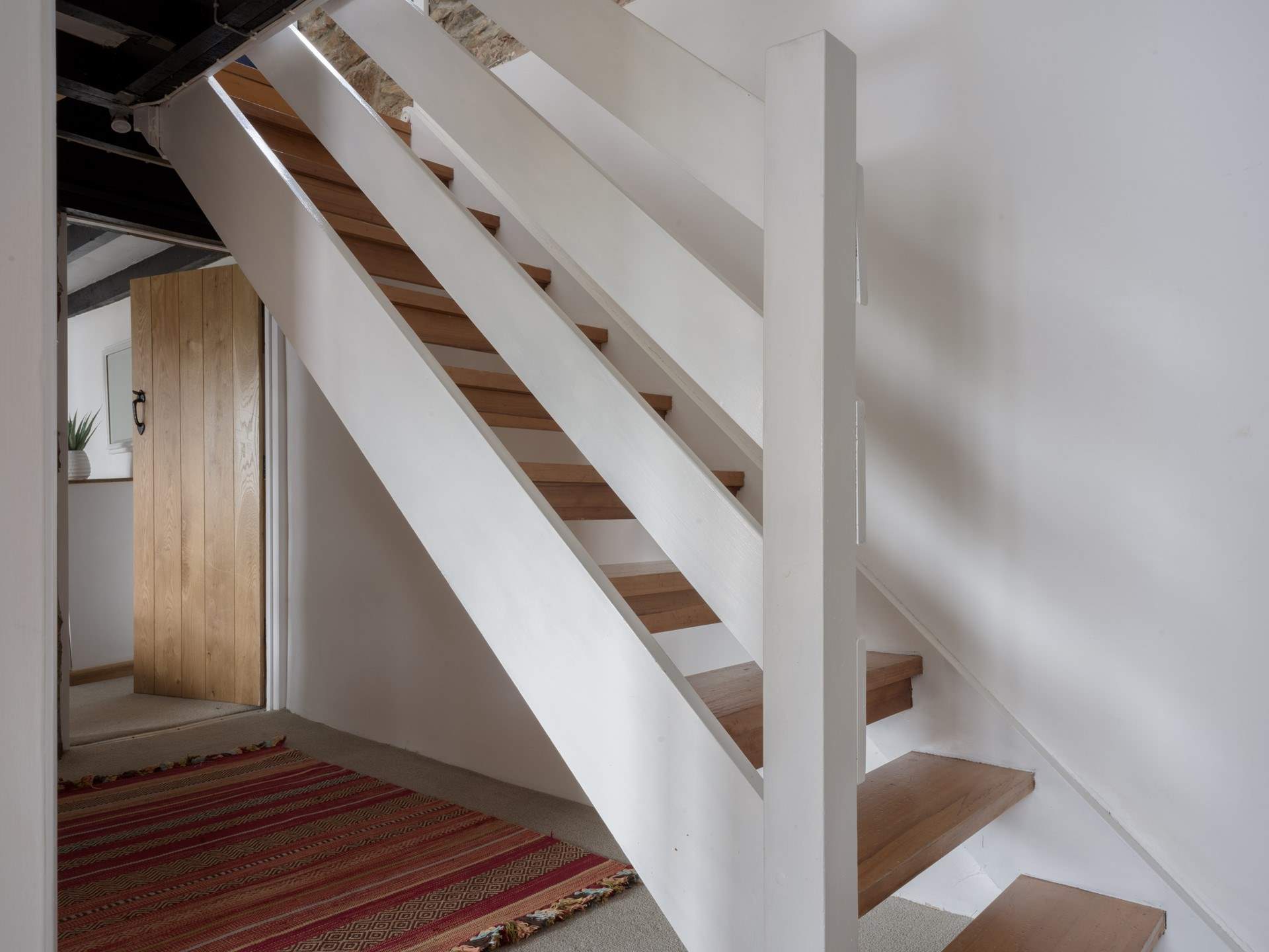 Head downstairs to the bedrooms and family bathroom.