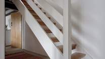 Head downstairs to the bedrooms and family bathroom.