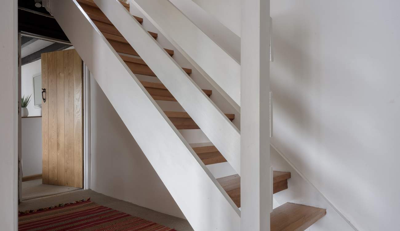 Head downstairs to the bedrooms and family bathroom.