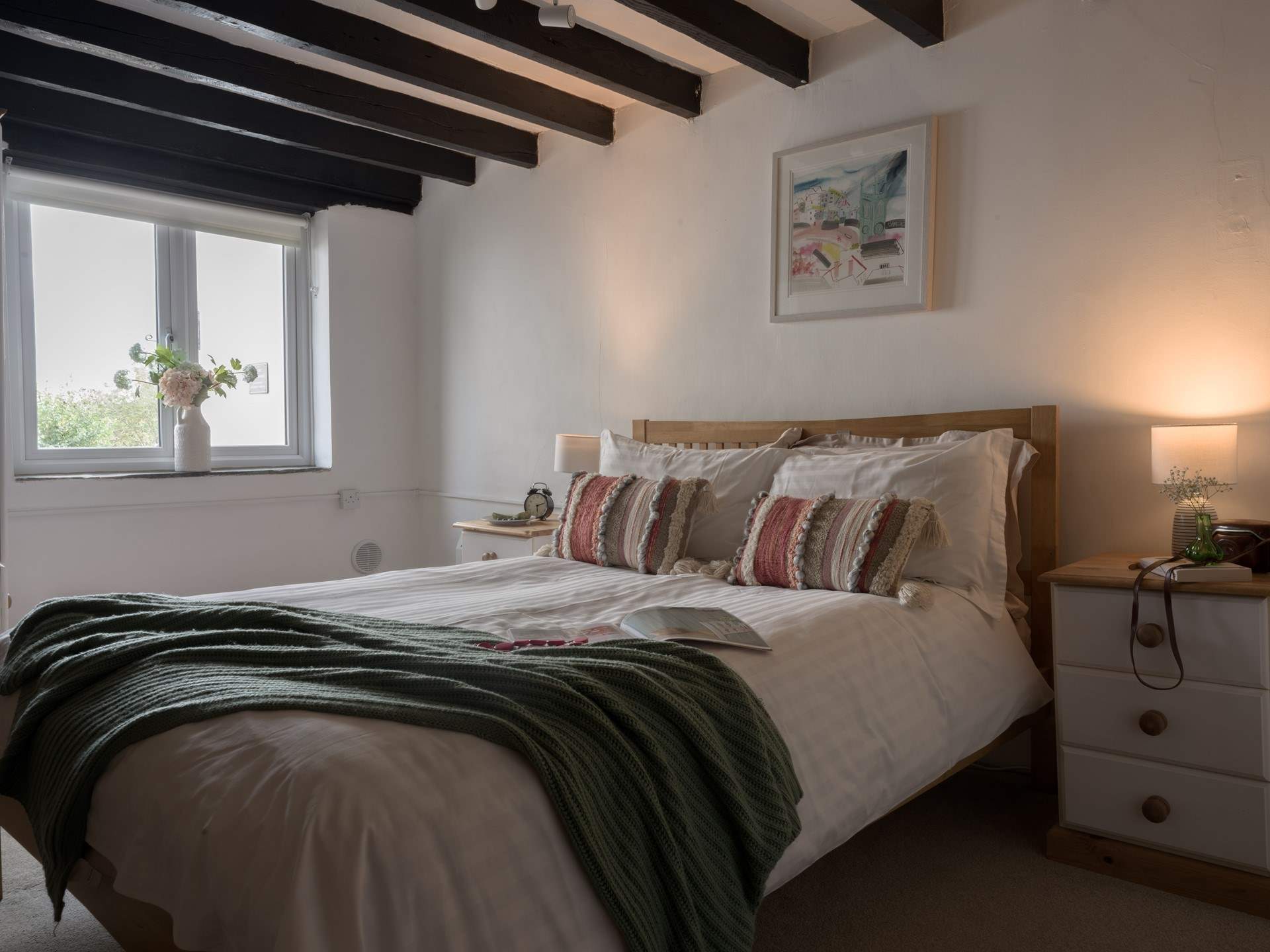 The muted tones and crisp linens will ensure a restful night's sleep. 