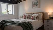 The muted tones and crisp linens will ensure a restful night's sleep. 