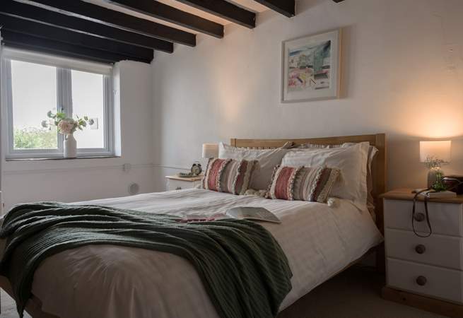 The muted tones and crisp linens will ensure a restful night's sleep. 