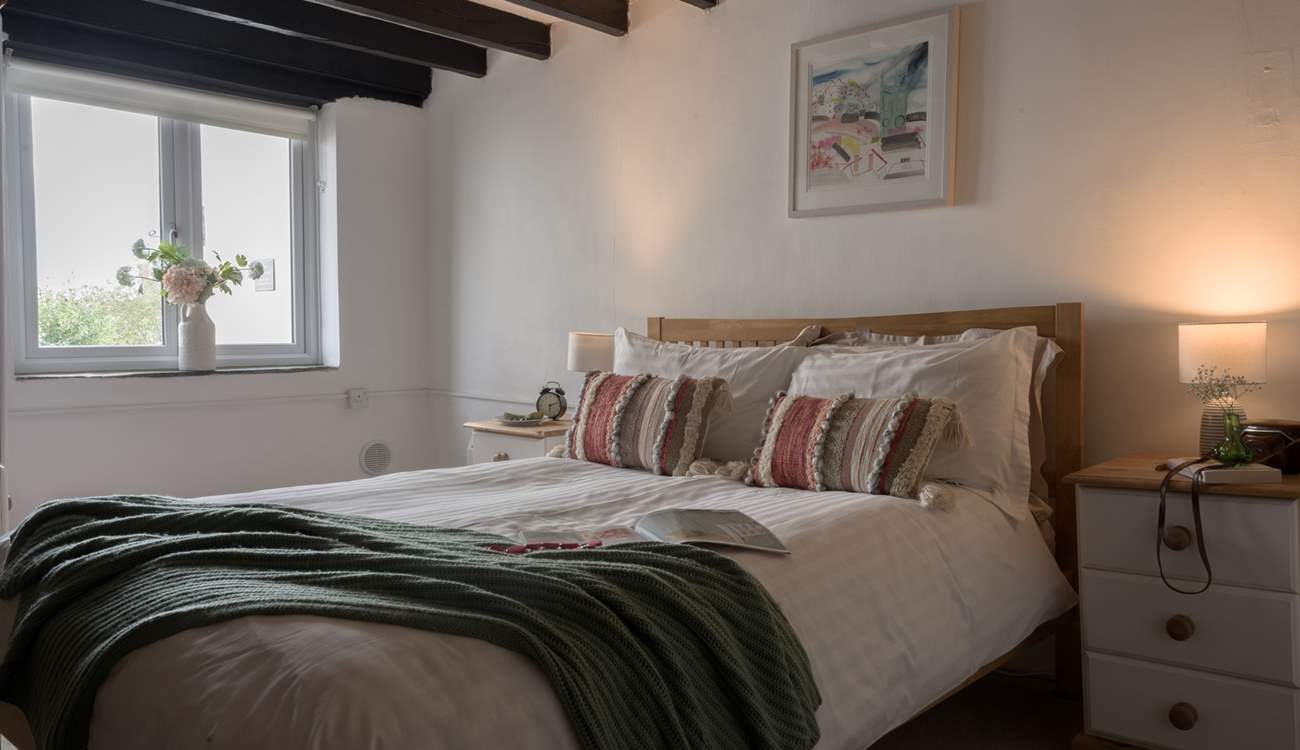 The muted tones and crisp linens will ensure a restful night's sleep. 