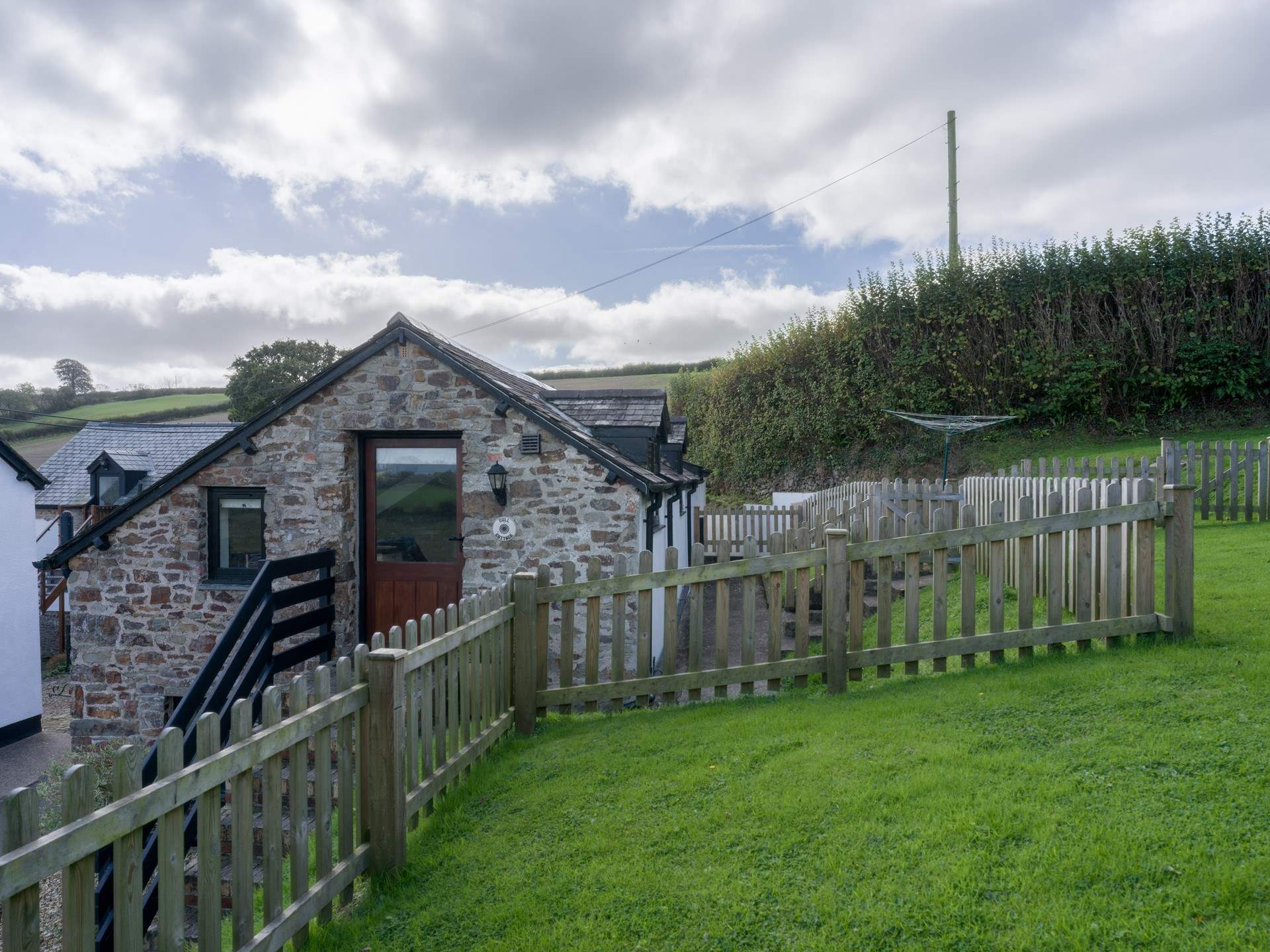 The lawn area provides a fully enclosed garden once the gate is closed.