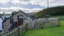 The lawn area provides a fully enclosed garden once the gate is closed.